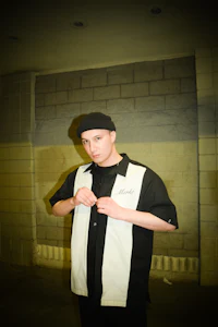 a man wearing a black and white shirt