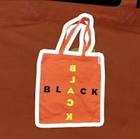 a tote bag with the word black on it