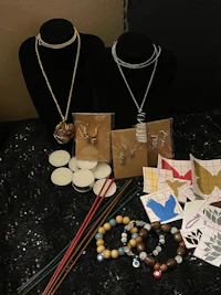 a collection of jewelry and other items on a table