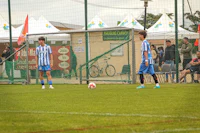 a group of people playing soccer on a field
