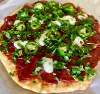 a pizza with peppers and cheese on it