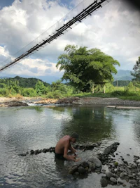 a man in a bathing suit in a river