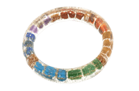 a rainbow colored glass ring on a black background