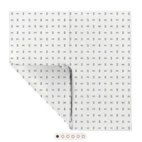 a white sheet with black squares on it