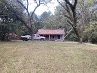 a small house with a truck parked in front of it