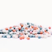 a pile of white, blue, and orange candy