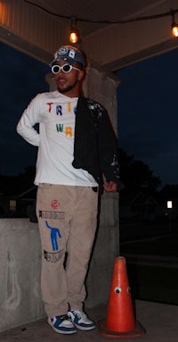 a man standing next to a cone