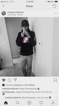 a man is taking a selfie in a hoodie