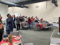 a group of people clapping in a church