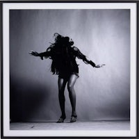 a black and white photograph of a woman dancing