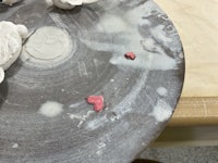 clay hearts on a plate on a table