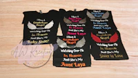 a group of t - shirts with angel wings on them