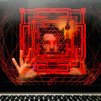 a laptop with an image of a man on it