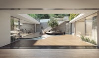 a modern living room with a wooden floor and a tree