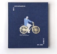 a blue book with a man on a bicycle