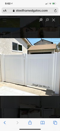 a picture of a white fence with a white gate