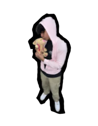 a man in a pink hoodie holding a teddy bear