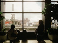 a group of people looking out a window