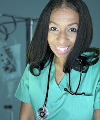 a nurse smiling in front of a stethoscope