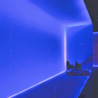a blue lit room with a car in it