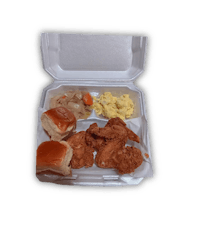 a box with chicken, biscuits and gravy