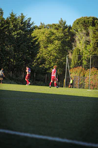 a group of people playing soccer on a field