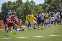 a group of people playing soccer on a field