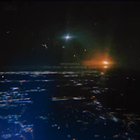 a view of a city at night from an airplane