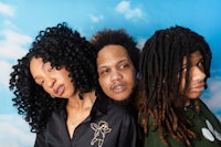 three people with dreadlocks posing for a photo