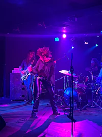 a group of people on stage at a concert