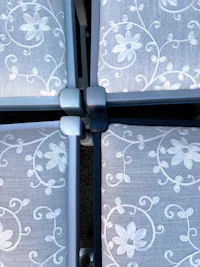 a close up of a set of chairs with a floral pattern