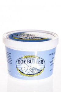 a tub of boy butter on a white surface
