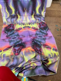 an image of a fire painting on a piece of cloth