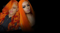 two women with orange hair in front of a black background