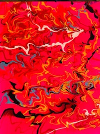 an abstract painting with red and blue swirls