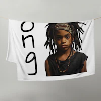 a boy with dreadlocks hanging on a towel