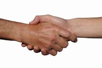 a man and woman shaking hands on a white background