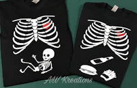 two skeleton t - shirts on a table