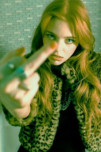 a woman wearing a leopard print jacket