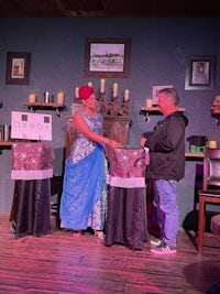 a man and a woman standing on a stage