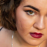 a woman wearing a necklace