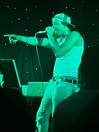a man is singing into a microphone