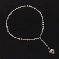 a silver necklace with a heart on it