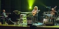 a group of musicians playing music on stage