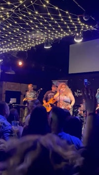 a group of people on stage at a concert