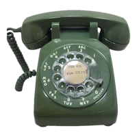 a green rotary telephone on a black background