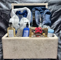 a gift basket with a bottle of wine and other items