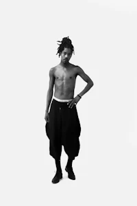 a black and white photo of a man posing