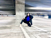 a woman posing in a parking garage