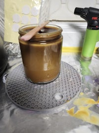 a jar of chocolate is sitting on top of a counter